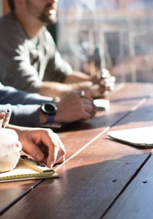 Professionals working together around a meeting table