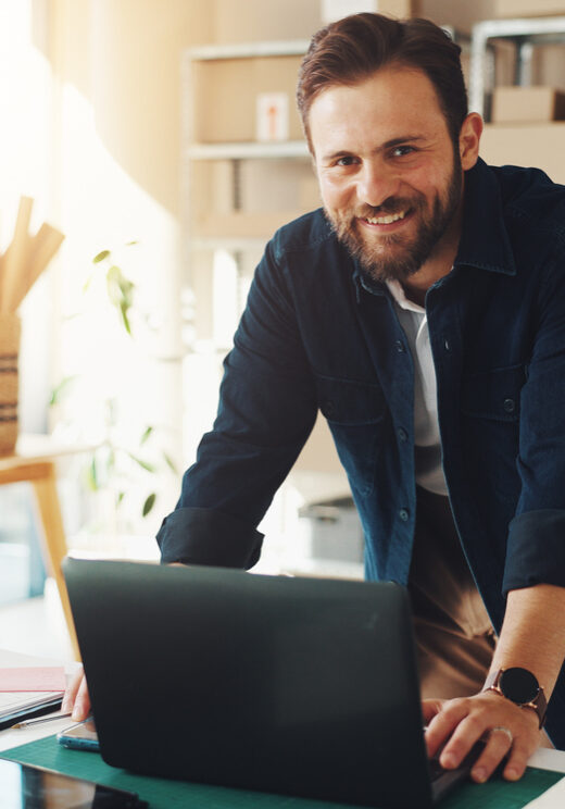 Man, portrait and laptop in small business for logistics, supply chain or distribution. Entrepreneur, distributor and technology in storage for export, startup growth or stock inventory for ecommerce